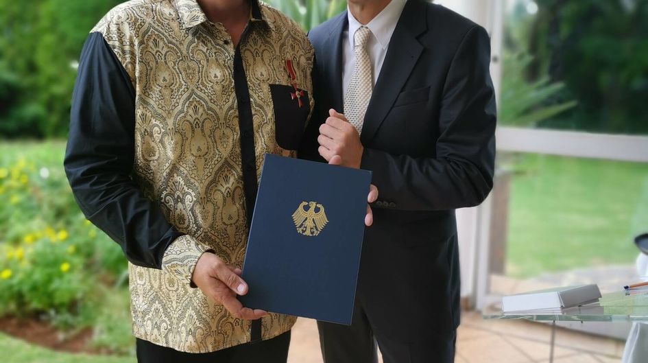 Mr. Andreas Woerster receiving the Order of Merit from the German Ambassador in South Africa 